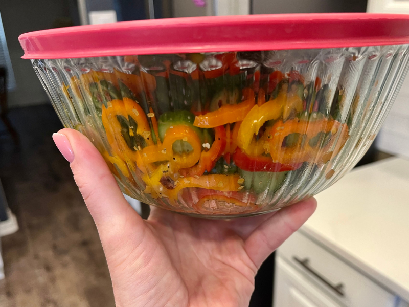 Cucumber Sweet Pepper Salad Store in Refrigerator. Bowl of Cucumber Salad ready to go into the fridge.