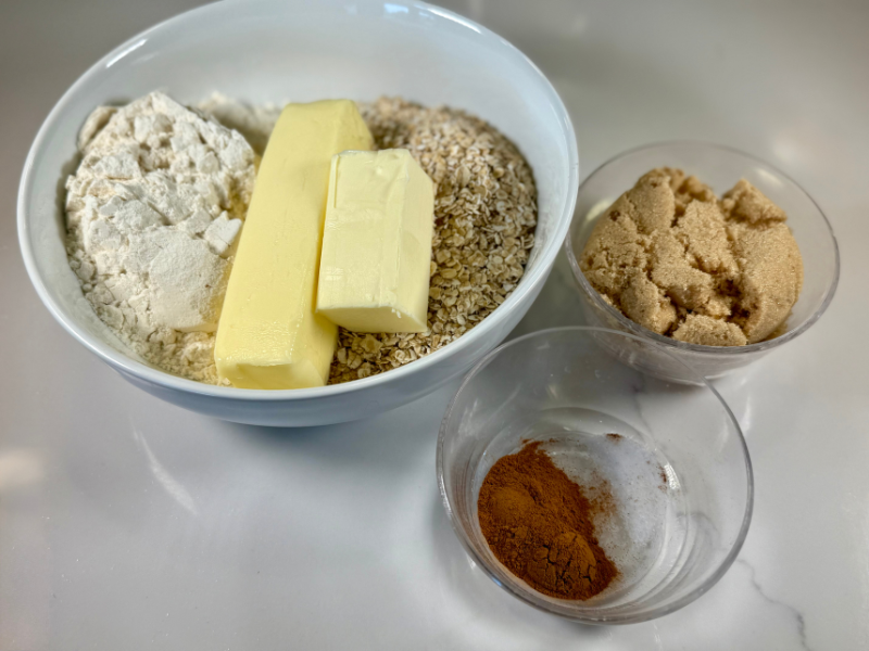 peach crisp crumble topping ingredients: butter, brown sugar, cinnamon, oatmeal, and flour.