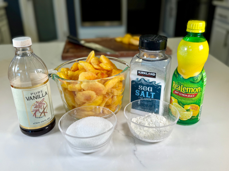 peach crisp filling ingredients: vanilla extract, peaches, salt, lemon juice, flour, and sugar.